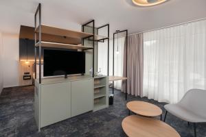 TV a/nebo společenská místnost v ubytování Stella Swiss Quality Hotel
