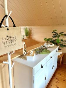 a kitchen with a white island in a room at Landhaus AUSZEIT in Borod