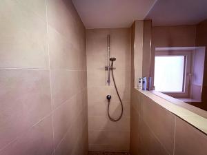 a bathroom with a shower with a shower head at Rebenglück in Göcklingen in Göcklingen