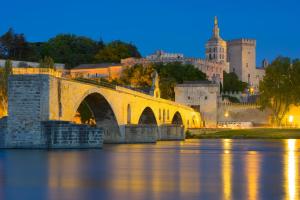 a bridge over the water in front of a castle at PROVENCE, MAISON SPACIEUSE et CONFORTABLE à coté de SPIROU,NARUTO et , WAVE ISLAND in Monteux