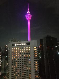a view of the samsung stratosphere tower at night at Vortex Suites KLCC by Comfy Stay in Kuala Lumpur