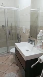 a bathroom with a sink and a shower and a toilet at IL CASOTTO in Itri +20 photos