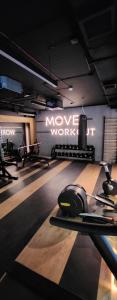 a gym with a moving work out equipment in a room at Luxury River Side apartament, Pool, Gym & Sauna in Kraków