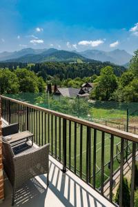 a balcony with a view of the mountains at The Lodge Transylvania in Bran