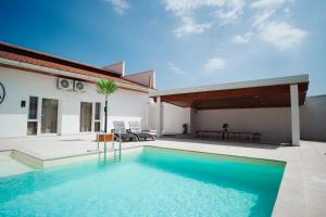 a swimming pool in the backyard of a house at Villa Apartments Blanco - Near Airport Banja Luka in Laktaši