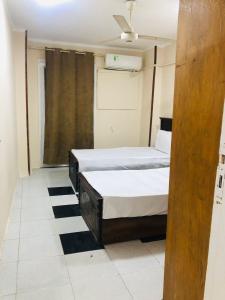 Ένα ή περισσότερα κρεβάτια σε δωμάτιο στο Two bedroom Apartment in central location in downtown Cairo