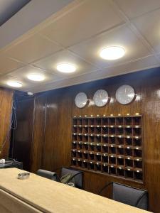 a conference room with a wall of wine bottles at Houres Hotel in Cairo