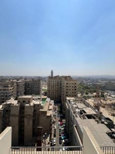 an aerial view of a city street with buildings at Houres Hotel in Cairo
