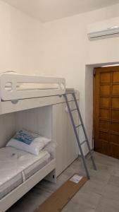 Ένα ή περισσότερα κρεβάτια σε δωμάτιο στο Casa Melody