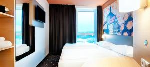 Postel nebo postele na pokoji v ubytování B&B Hotel Bamberg