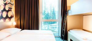 Postel nebo postele na pokoji v ubytování B&B Hotel Bamberg + 28 fotografií