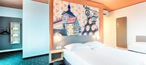 Postel nebo postele na pokoji v ubytování B&B Hotel Bamberg