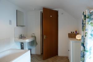 a bathroom with a sink and a toilet and a mirror at Killard Farm in Bellaghy +18 photos