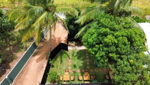 an overhead view of a house with palm trees at Sigiri Serenity Hostel in Sigiriya