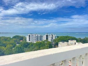 a view of a city from a balcony at Mambo Sea view 3bd Penthouse Mombasa in Mombasa