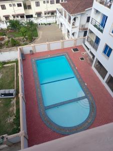 an overhead view of a large blue swimming pool on a building at Deanway homes in Mombasa