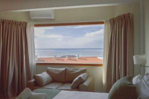 a room with a couch and a large window at Fonte Arcada in Villa Gesell +102 photos