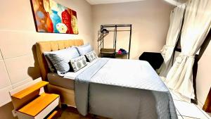 Postel nebo postele na pokoji v ubytování Kitnet no coração de Olaria