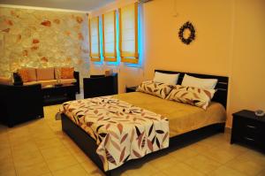 A bed or beds in a room at Pyrgos Zante Suites