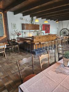 a restaurant with tables and chairs in a room at Partyraum Waldeslust Preis nach Anfrage in Oelde