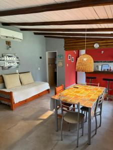 a bedroom with a bed and a table and chairs at Aratiri Cabañas, Un Lugar En El Bosque.. in Colón