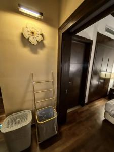 a room with a ladder and a door and a room with a bed at Goldcoast Palm Tree Sepang Luxury Resort in Sungai Pelik
