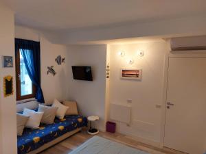 Un televizor și/sau centru de divertisment la B&B Le Stanze Di Papà