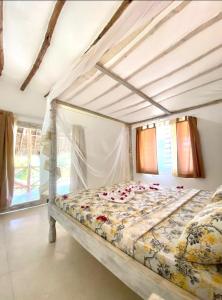 Postel nebo postele na pokoji v ubytování Blue Diamond Villa Watamu