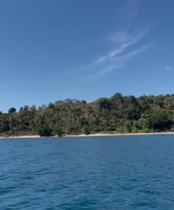 an island in the middle of a body of water at villa comboc gili in Gili Gede