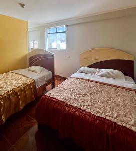 Postel nebo postele na pokoji v ubytování Hostal Wassiki + 5 fotografií