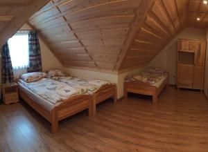 Postel nebo postele na pokoji v ubytování Pokoje u Basi