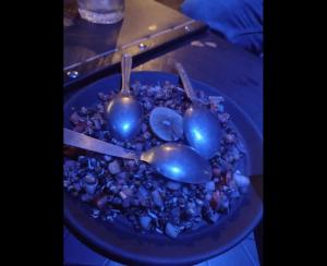 a blue plate of food with blue fruits and spoons at Hotel Apex Intercontinental in Jaipur