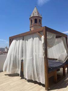 a hammock on the roof of a building at La Villa del Sastre in Vélez-Málaga