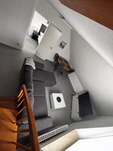 an overhead view of a living room with a staircase at FeWo an der Nordseeküste II in Wilhelmshaven