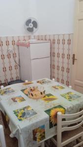 a table with a table cloth on top of it at Casa San Sebastiano in Ficarra +19 photos