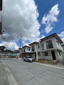 a car parked in front of a white house at Casa Lyma in Candelaria +3 photos