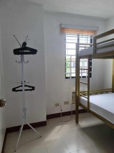 a bedroom with two bunk beds and a window at Casa Lyma in Candelaria +3 photos