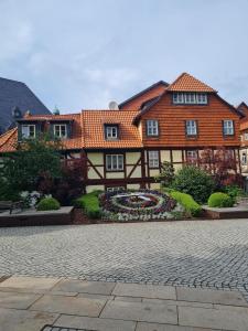 a large house with a garden in front of it at Harz-Stübchen in Wernigerode +9 photos