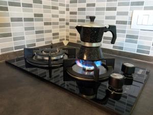 a coffee pot on a stove in a kitchen at Casa Bonifacio in Scalea