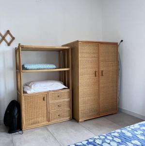 a room with a bunk bed and a wooden cabinet at Casa Adele in Grugliasco