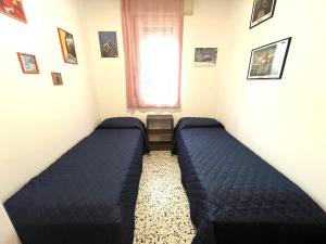 Postel nebo postele na pokoji v ubytování Villa Castorini 3