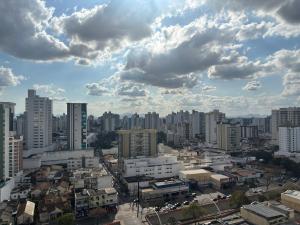 a city with buildings and clouds in the sky at Flat Aconchegante in Campos dos Goytacazes