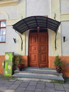 a door to a building with a black awning at Kuninga apartment in Pärnu +10 photos