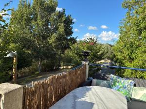 a wooden fence on a balcony with trees at Chez iris in Noisy-le-Grand