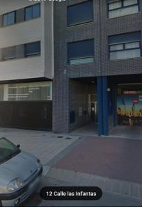 a car parked in front of a building at Bienvenidos in Burgos