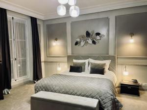 a bedroom with a large bed in a room at L'appart du centre in Paris