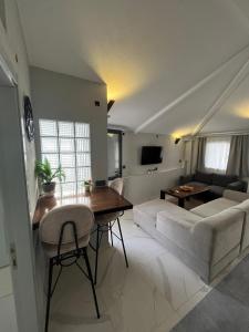 a living room with a couch and a table at Bodrum Center 2plus1 for 6 people - Citak Mansions in Bodrum City