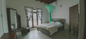 Postel nebo postele na pokoji v ubytování Wimalee resort