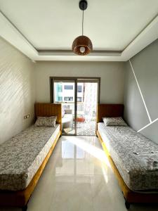 Ένα ή περισσότερα κρεβάτια σε δωμάτιο στο Appartement Chaleureux