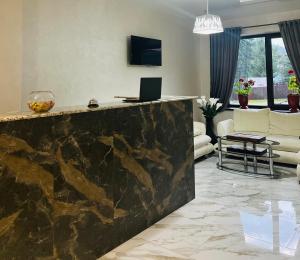 a living room with a large marble counter top at Madison in Bukovel